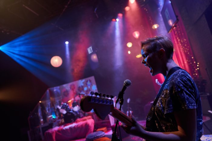 Ask Me Anything Image showing Kylie signing into a microphone