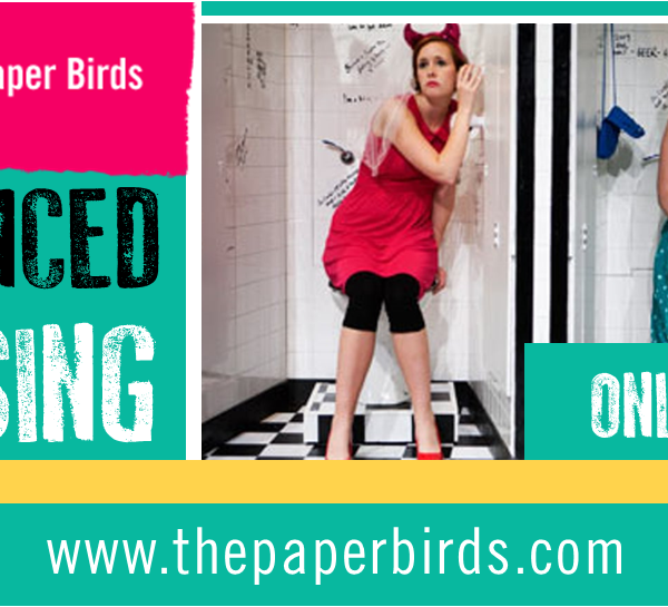 Distanced Devising image - showing two girls with their ears to a wall in a toilet from our show Thirsty