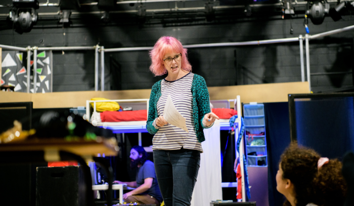 Young Creative Artists Wanted - image shows Kylie talking to young artists