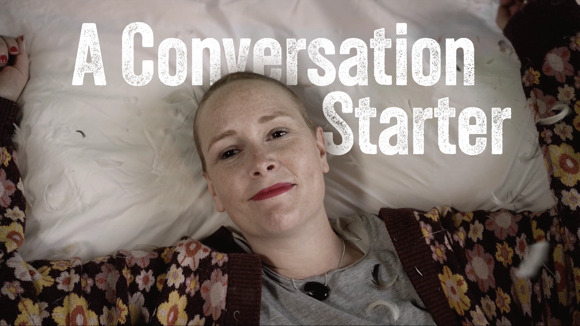 Kylie lying on a pillow looking at the camera